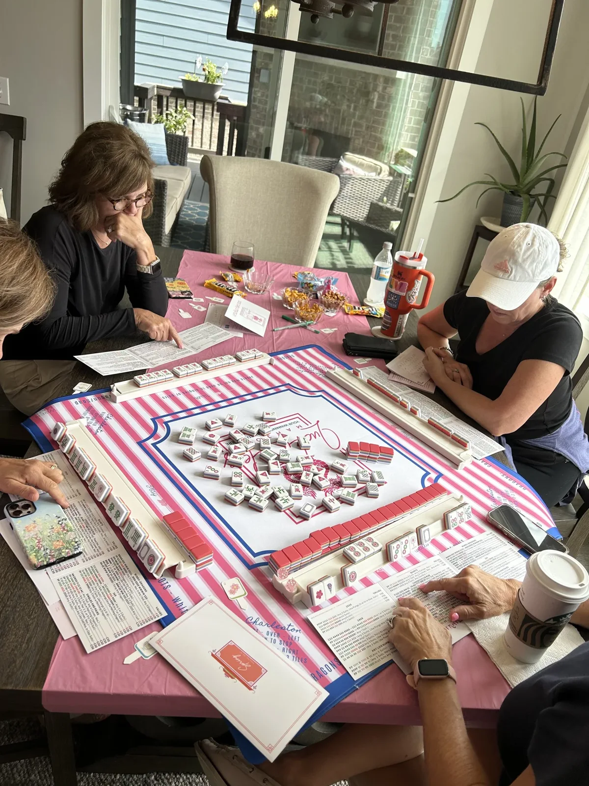 Players enjoying mahjong together at The Atelier